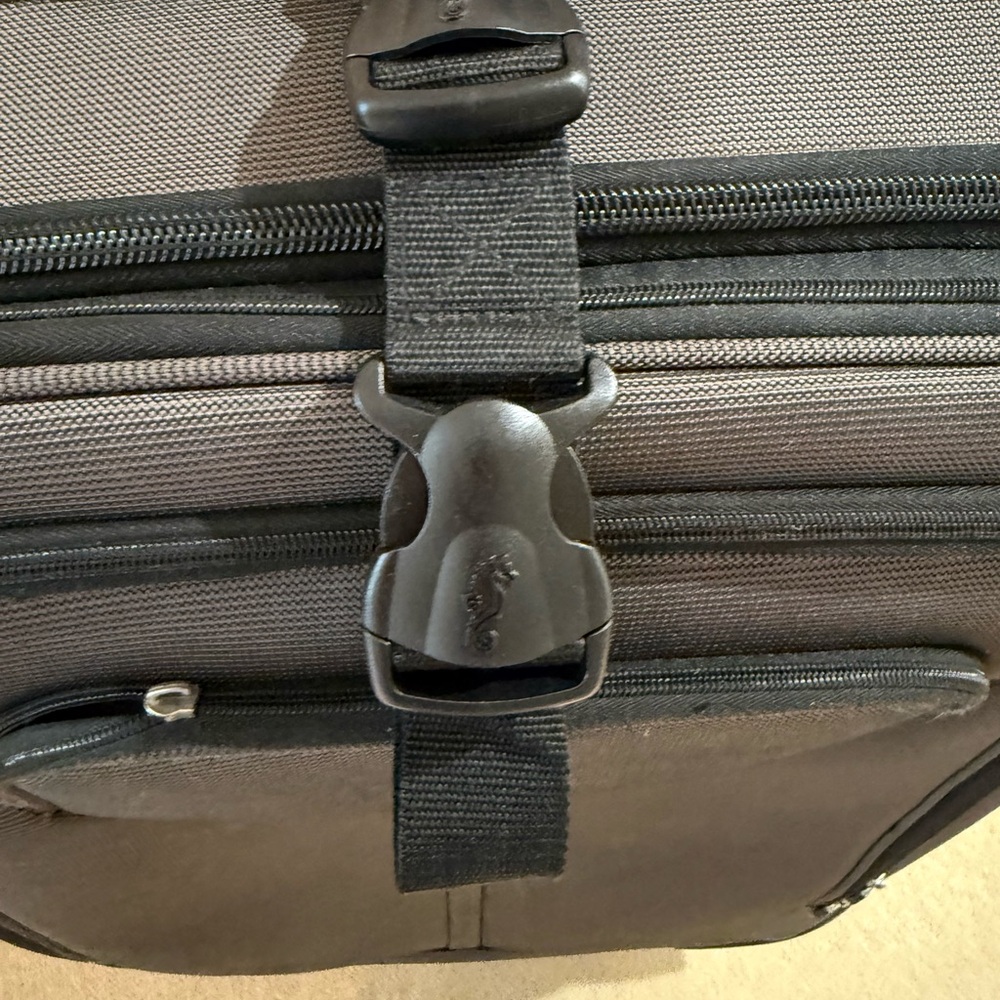 Gray Travel Bag with Secure Closure and Durable Fabric